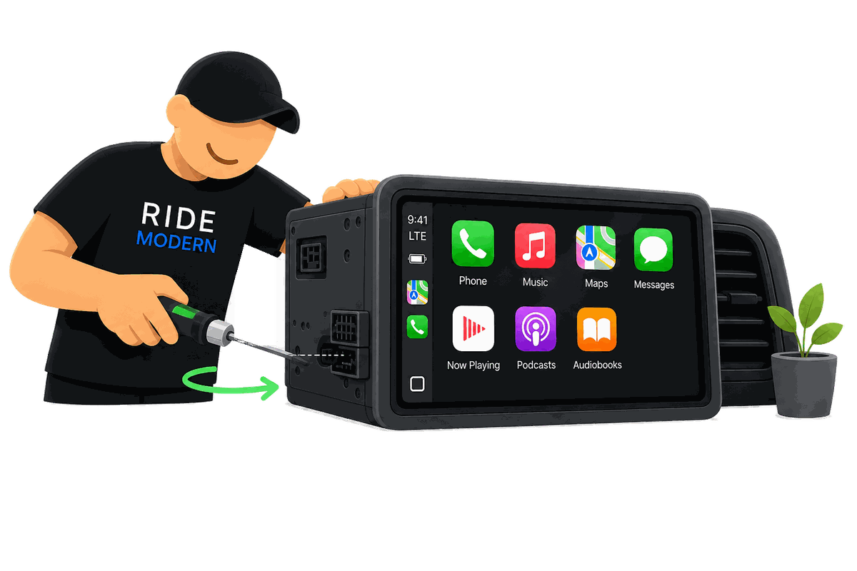 A Ride Modern technician installing a vehicle-specific touchscreen head unit running Apple CarPlay